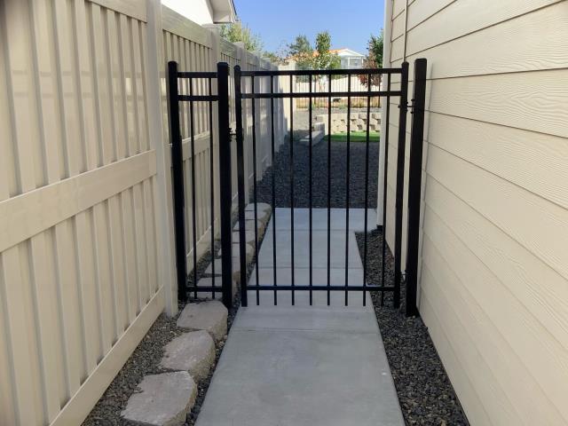 Meridian, ID - We recently finished putting in a new ornamental gate and vinyl fence in Meridian. Meridian, ID - We recently finished putting in a new ornamental gate and vinyl fence in Meridian.