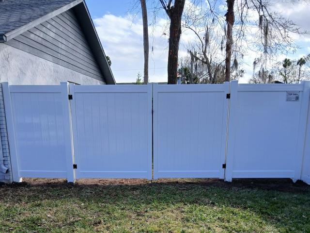 Ormond Beach, FL - We love when a happy customer recommends us to their friends and neighbors! This time, we were referred by a great client whose fence we completed just last month. The neighbor came to us with concerns about their old, worn-out wood fence and the hassle of difficult-to-open gates.
After discussing their needs, we helped them upgrade to a beautiful, low-maintenance white vinyl fence that not only enhances curb appeal but is also a breeze to operate. Ormond Beach, FL - We love when a happy customer recommends us to their friends and neighbors! This time, we were referred by a great client whose fence we completed just last month. The neighbor came to us with concerns about their old, worn-out wood fence and the hassle of difficult-to-open gates.
After discussing their needs, we helped them upgrade to a beautiful, low-maintenance white vinyl fence that not only enhances curb appeal but is also a breeze to operate.
