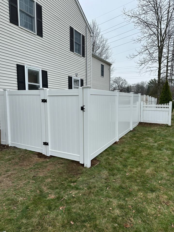 Wrapping up a new white vinyl privacy fence in Darien! Dogs are happy and safe inside a new, larger back yard!