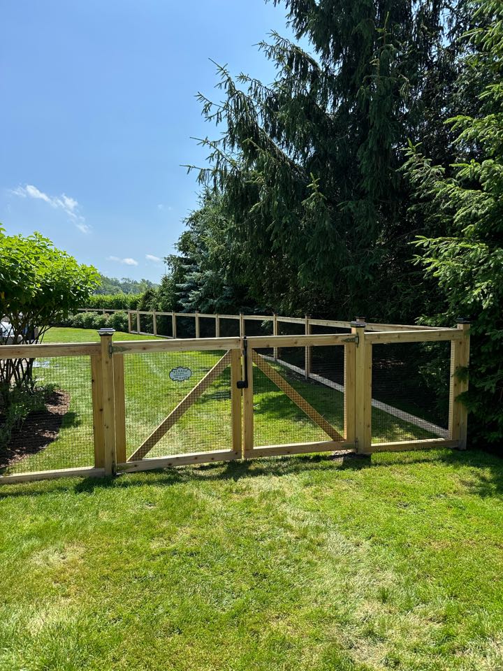 Finishing up a beautiful new cedar framed fence with black coated vinyl mesh to keep the dogs safe inside! A fence that meets all pool code requirements but looks beautiful as well! Right on the sound in Darien. 