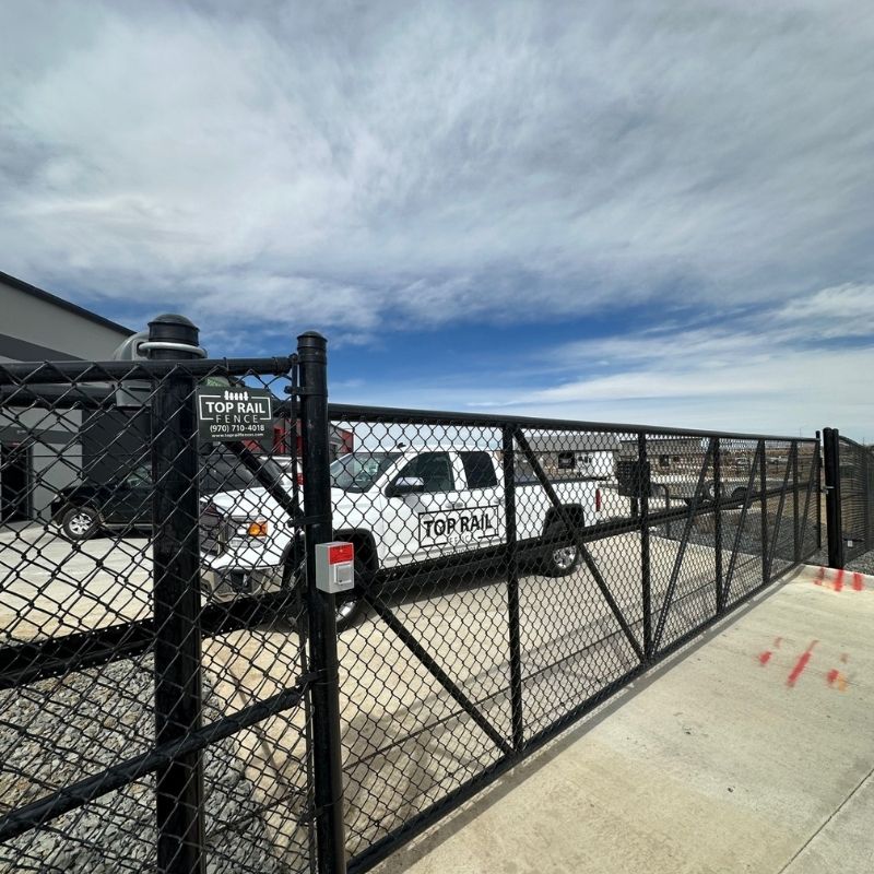 black chain link commercial gate installed by Top Rail Fence